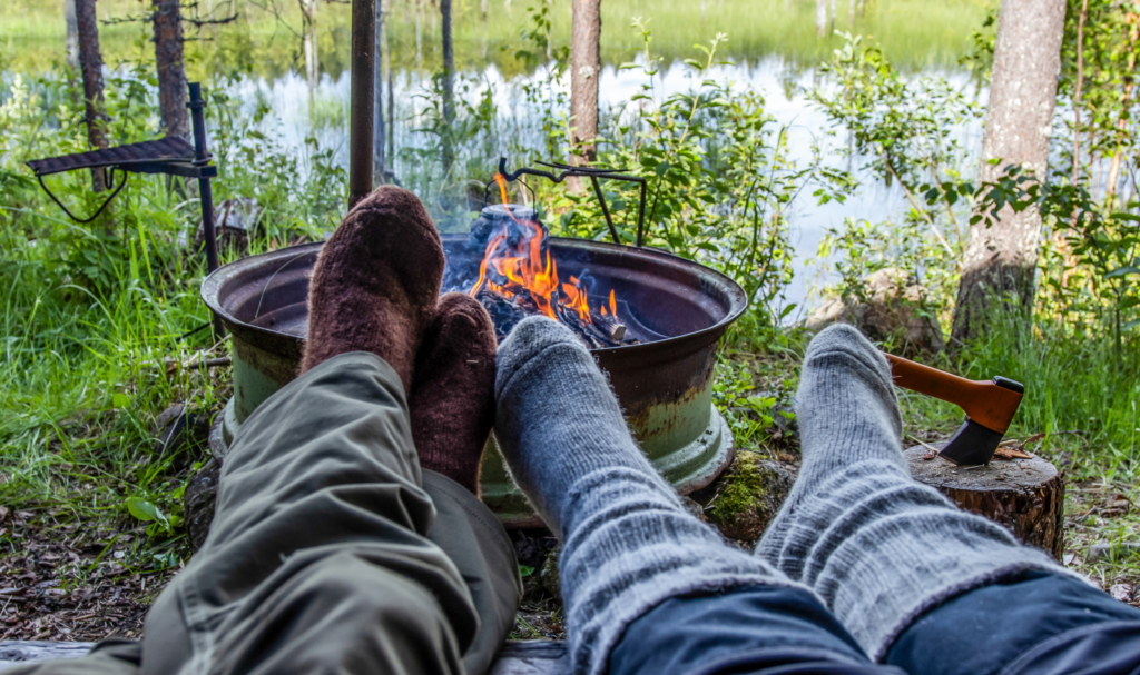 Wool socks at the edge of campfire