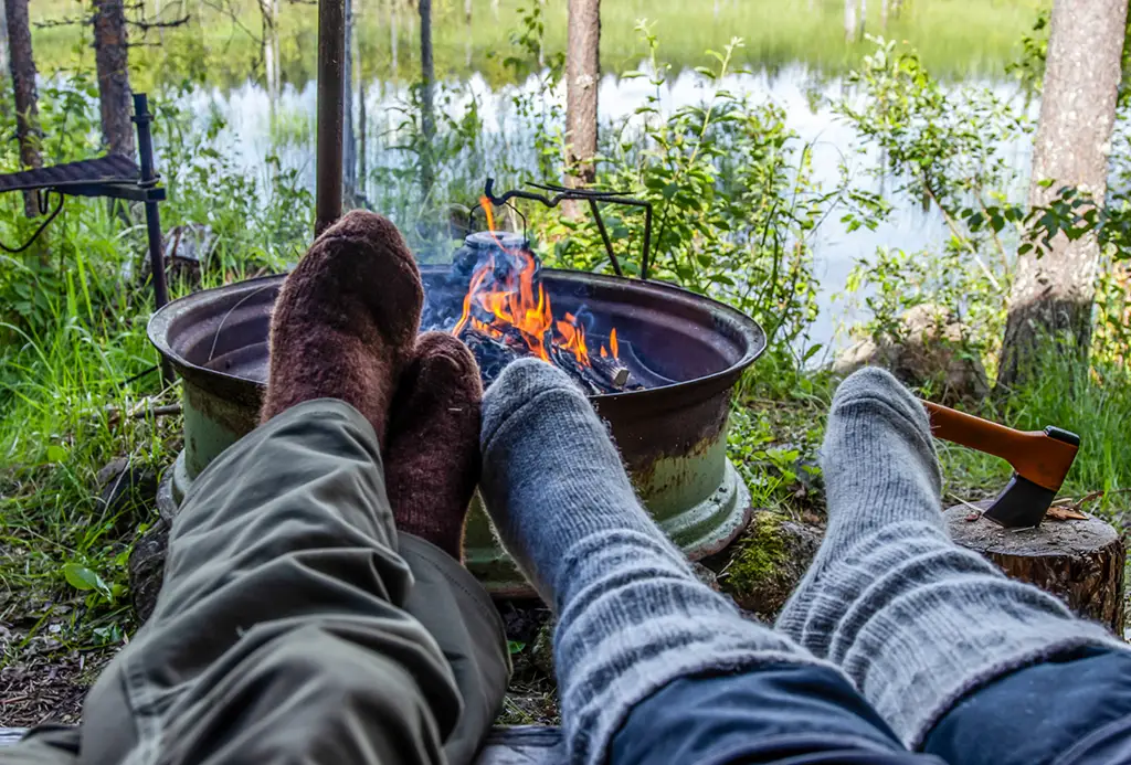 Wool socks at the edge of campfire